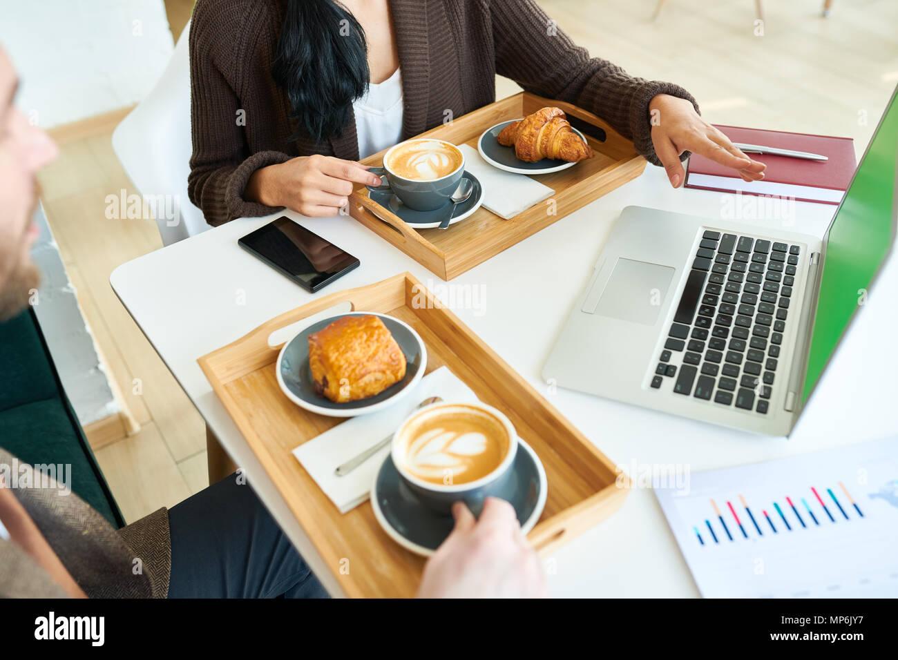 Business People Enjoying Coffee during Meeting Stock Photo