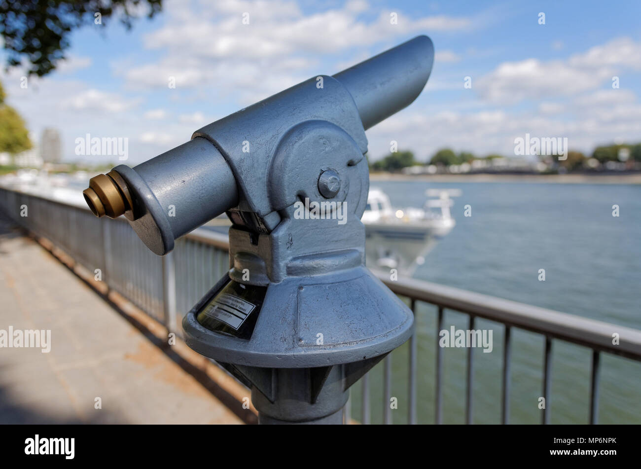 Coin-operated telescope at riverbank Stock Photo