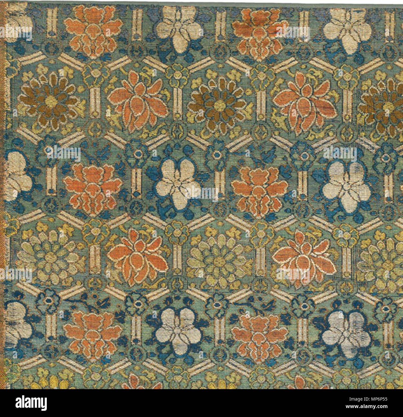 23.5 x 12.5 inches    . English: RH3571, Textile Fragment. 27 x 29.5 in (69 x 75 cm). 14th/17th Century. Published in Threads of Imagination, Spink Catalog 1999, pl 16. A panel of silk brocade, woven with a hexagonal lattice enclosing pink, white, and yellow flowers including peonies and lotus, woven with a gilt outline against a sea-green ground. Ming Dynasty. $6,000. Ming brocades were sought after the world over, their eye-pleasing patterns making their way to the viceroyalties of Mexico and Peru, India, Turkey, western Europe and Japan where they influenced local weaving motifs and techniq Stock Photo