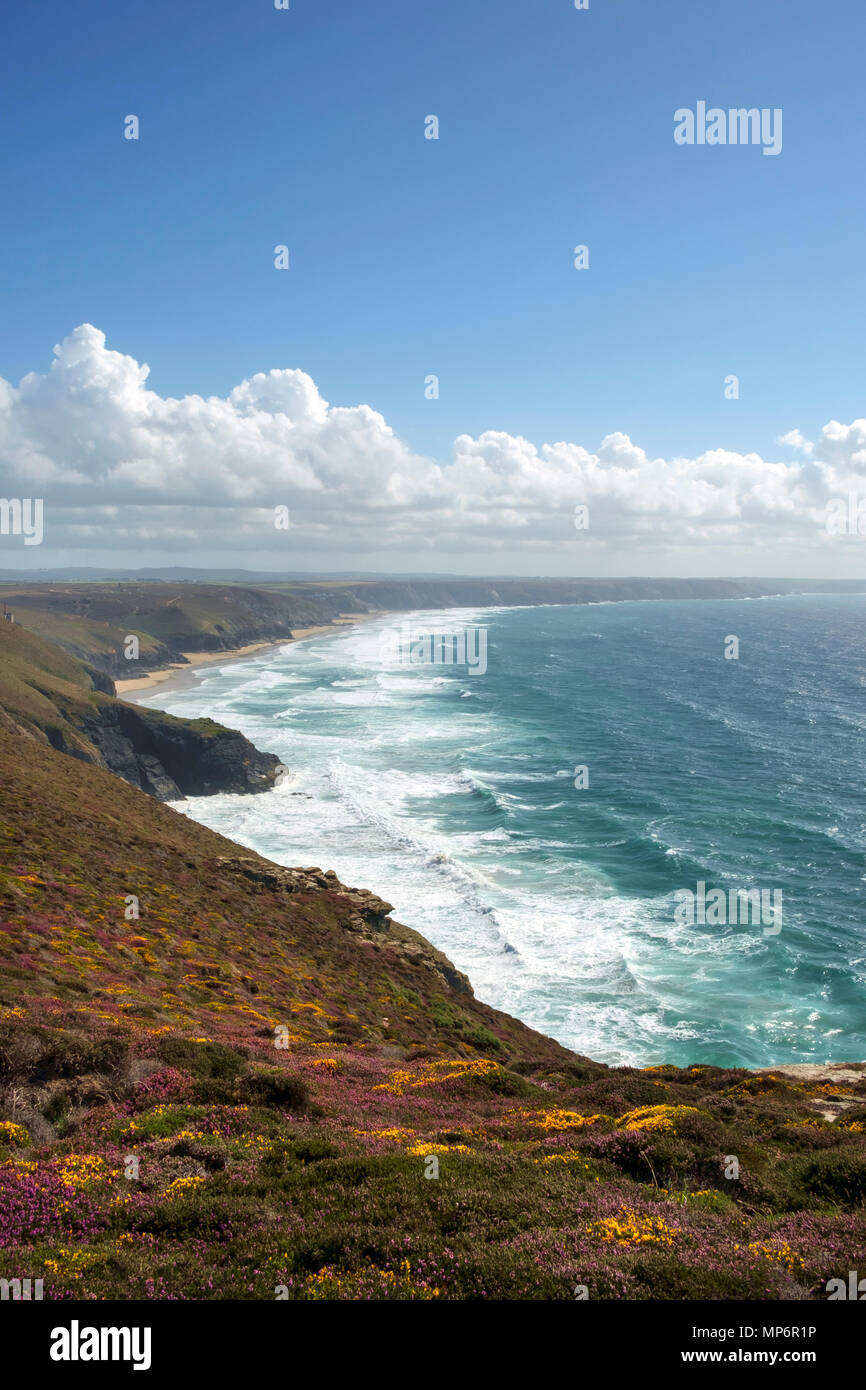 View along the St Agnes Heritage Coast towards Chapel Porth Beach on a sunny summer afternoon in Cornwall, UK Stock Photo