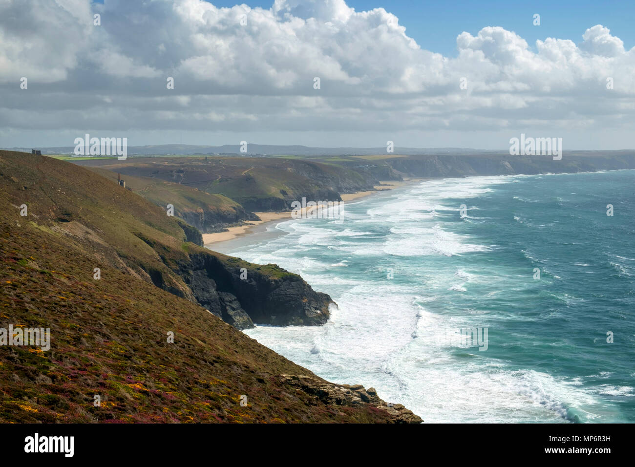 View along the St Agnes Heritage Coast towards Chapel Porth Beach on a sunny summer afternoon in Cornwall, UK Stock Photo