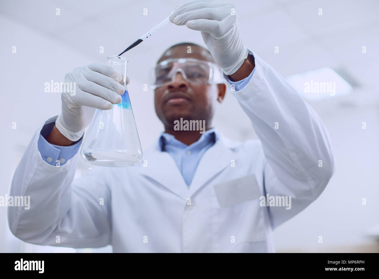 Determined biologist working with tubes in the lab Stock Photo