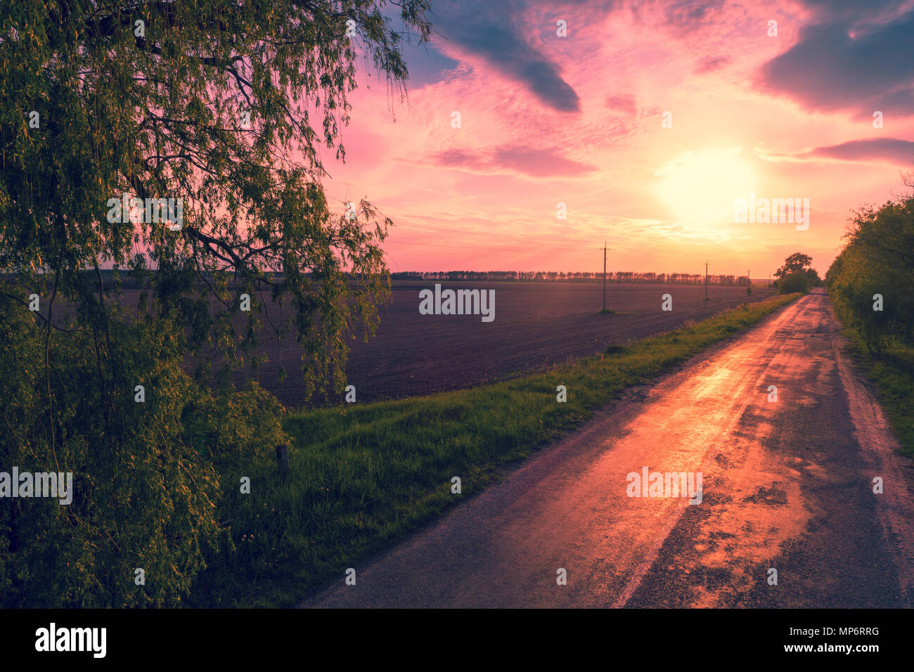 Aerial view of a country road at sunset. Rural evening landscape Stock ...