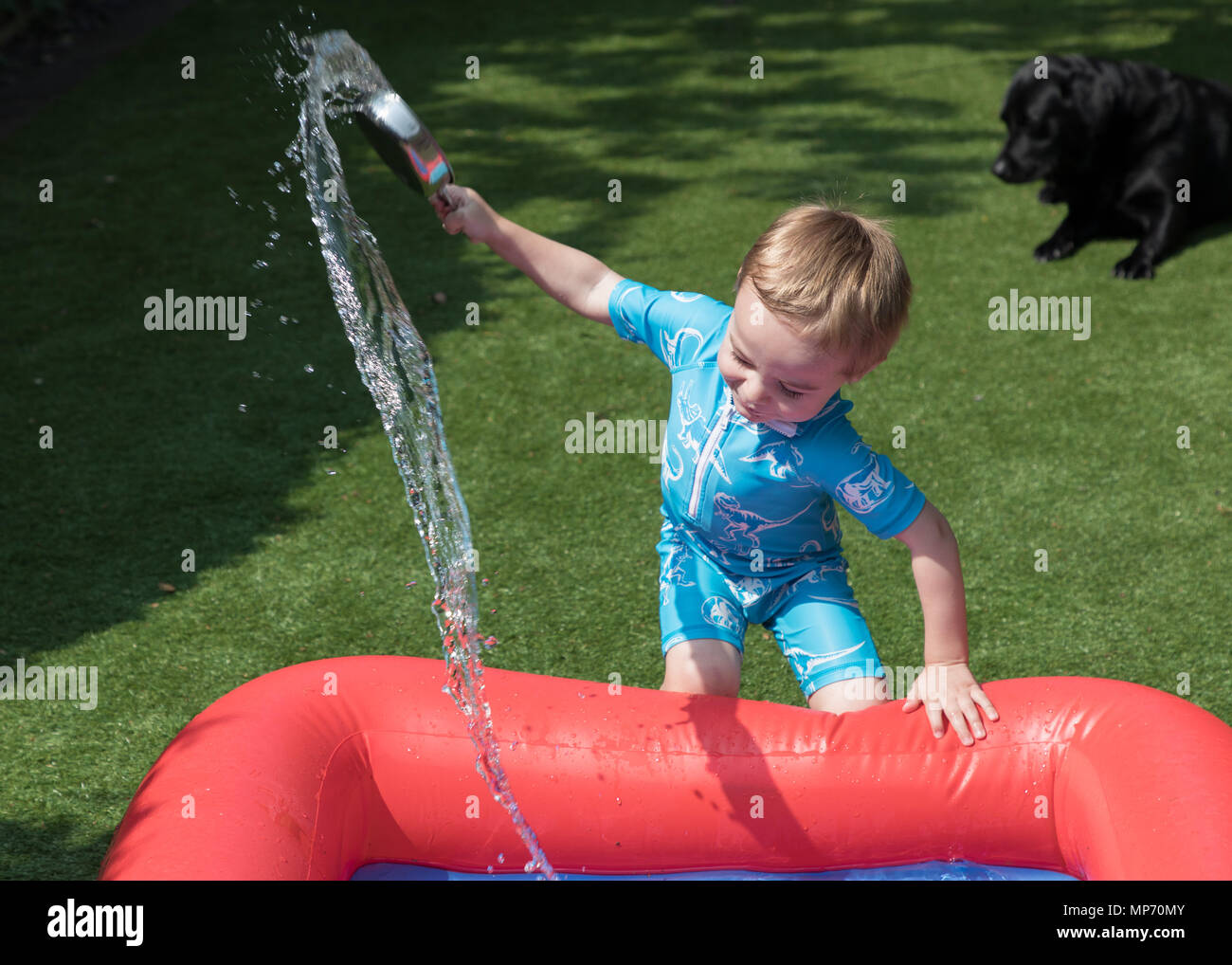 Worksop, Nottinghamshire, UK. Monday 21st May 2018. Sam Wilson, aged two, plays in a paddling pool during a heat wave in Worksop, Nottinghamshire. Credit: James Wilson/Alamy Live News Stock Photo