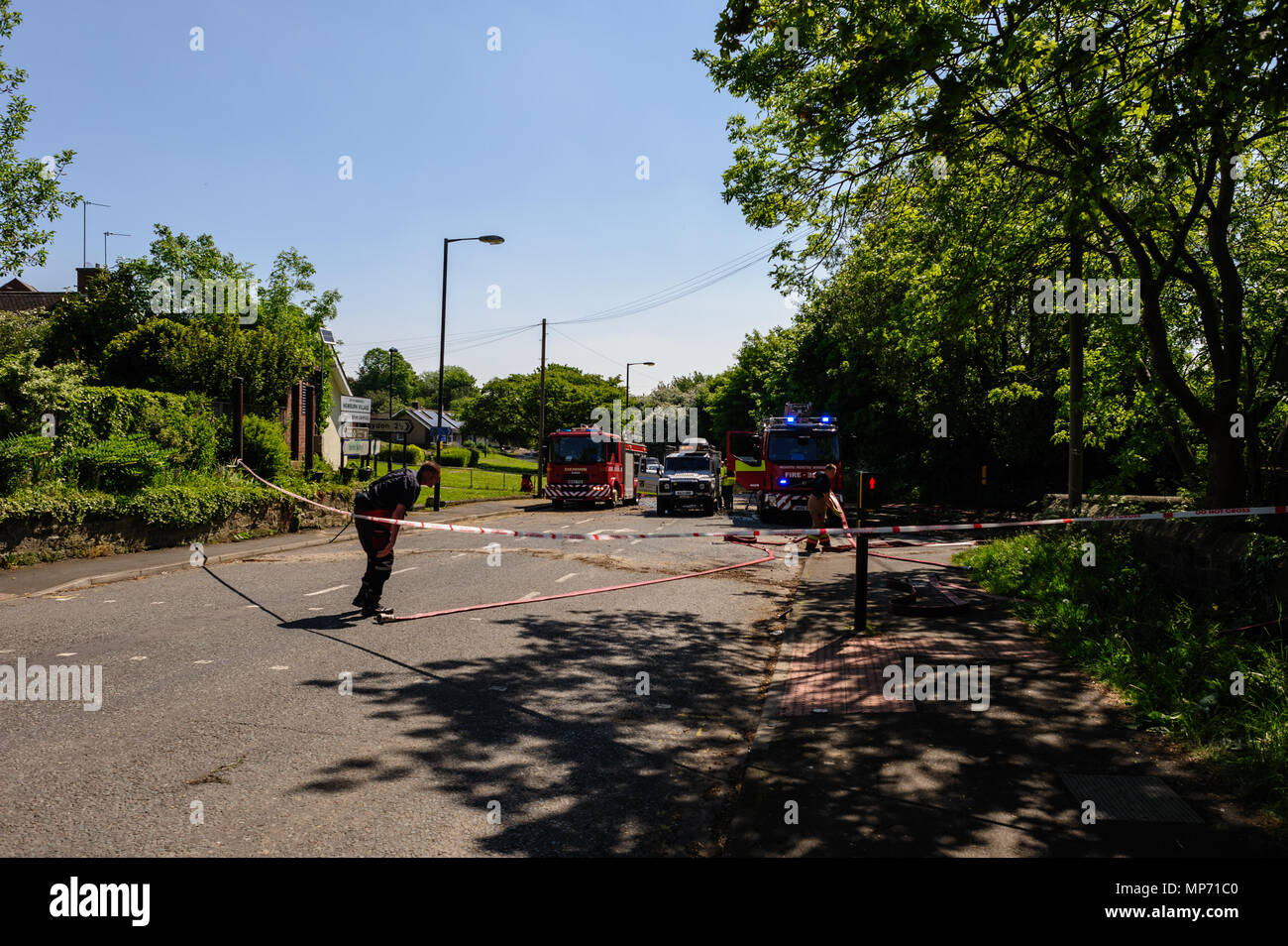 Newburn, UK. 21st May 2018. Firefighters Tend to a Burst Water Main On Station Road, Newburn Credit: James W. Fortune/Alamy Live News Stock Photo