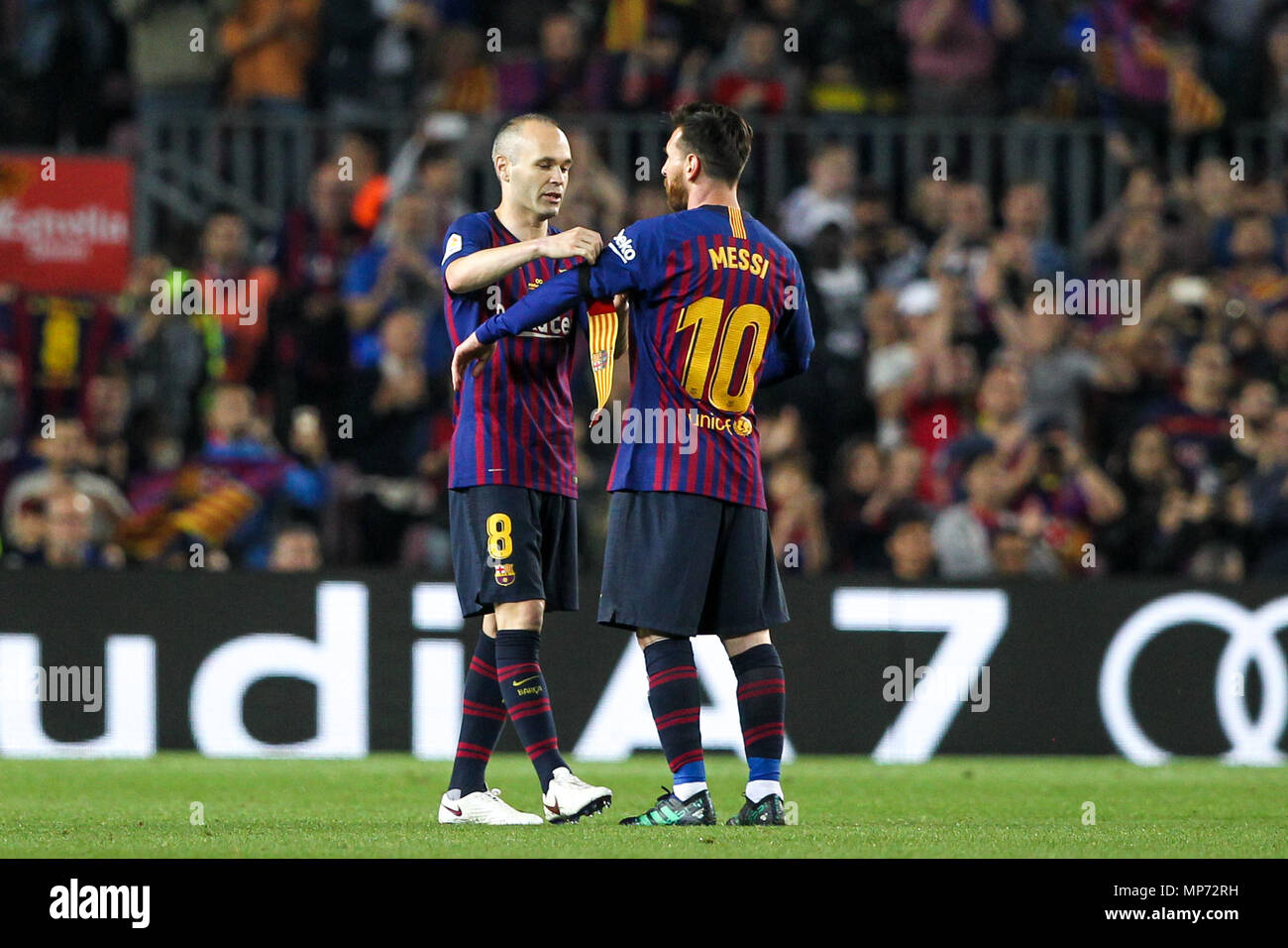 Barcelona, 20th May: Andres Iniesta of FC Barcelona gives Lionel Messi of  FC Barcelona the captain armband as he es substituted during the 2017/2018  LaLiga Santander Round 38 game between FC Barcelona