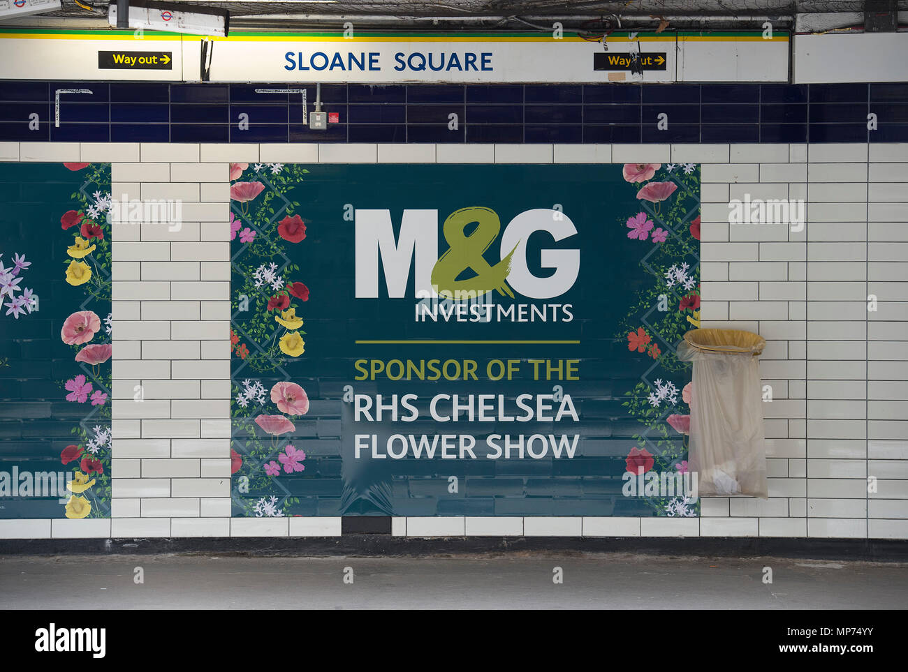 Royal Hospital Chelsea, London, UK. 22 May, 2018. Press day for the RHS Chelsea Flower Show 2018. Photo: Show Sponsor M&G Investments posters at Sloane Square underground station, the closest station to the event. Credit: Malcolm Park/Alamy Live News. Stock Photo