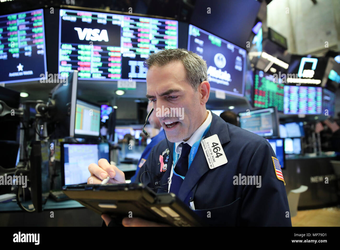 New York, USA. 21st May, 2018. A trader works at the New York Stock Exchange in New York, the United States, on May 21, 2018. U.S. stocks closed higher on Monday. The Dow rose 1.21 percent to 25,013.29, and the S&P 500 rose 0.74 percent to 2,733.01, while the Nasdaq increased 0.54 percent to 7,394.04. Credit: Wang Ying/Xinhua/Alamy Live News Stock Photo