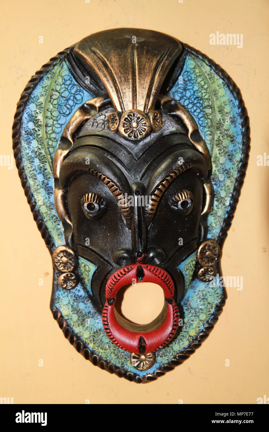 Traditional cuban mask on yellow background, clayping work Stock Photo