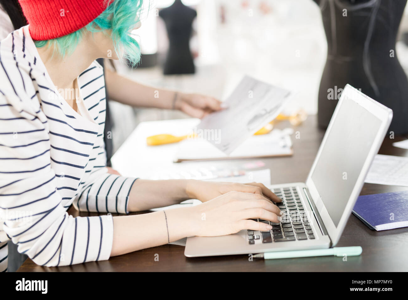 Creative Young Women Using Laptop Stock Photo