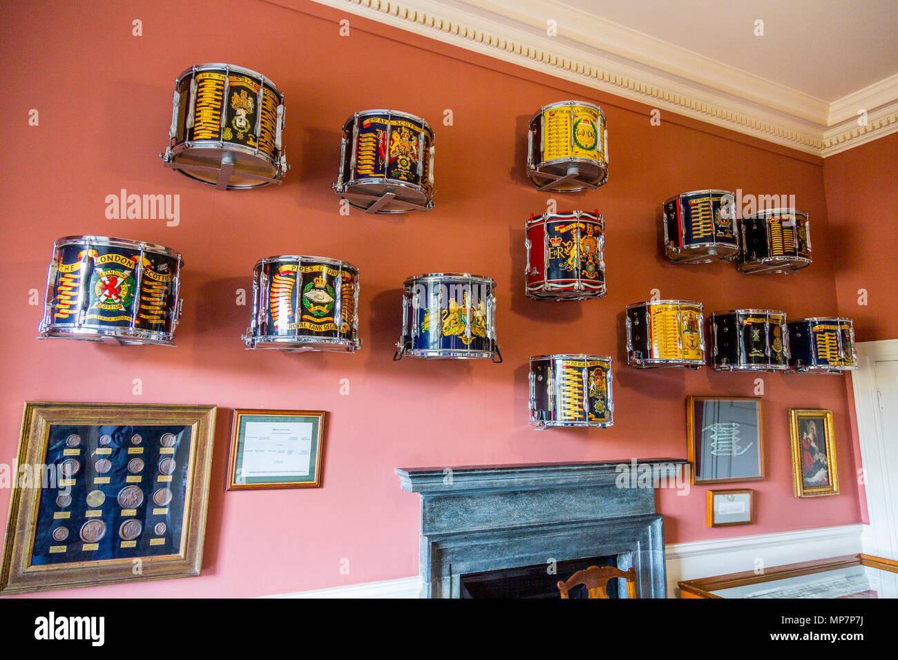 A display of colourful regimental drums in the Clan Room at Inveraray Castle, Argyll & Bute, Scotland, UK Stock Photo