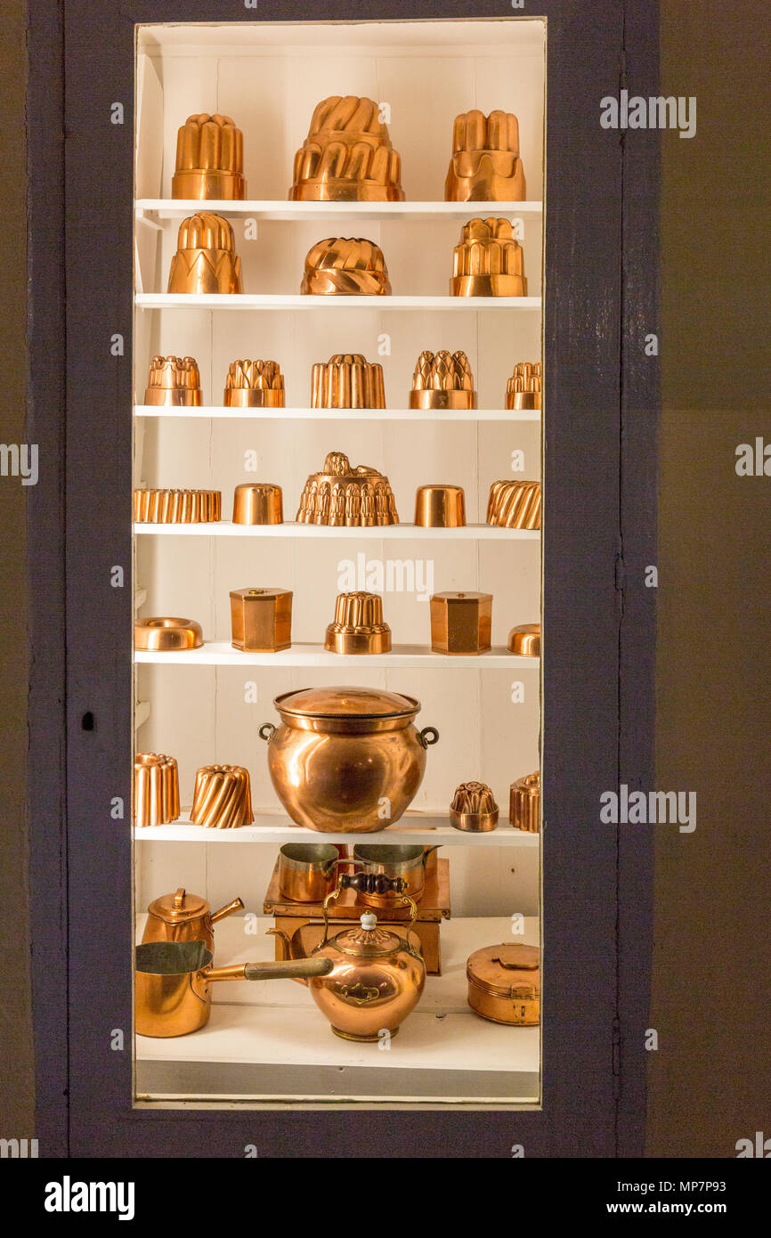 A display of copper moulds and vintage kitchen equipment in the Old Kitchen at Inveraray Castle, Argyll & Bute, Scotland, UK Stock Photo
