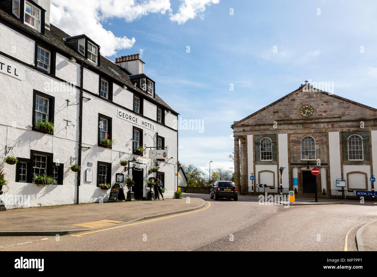 The historic George Hotel and parish church in Main Street Inveraray, Argyll & Bute, Scotland, UK Stock Photo