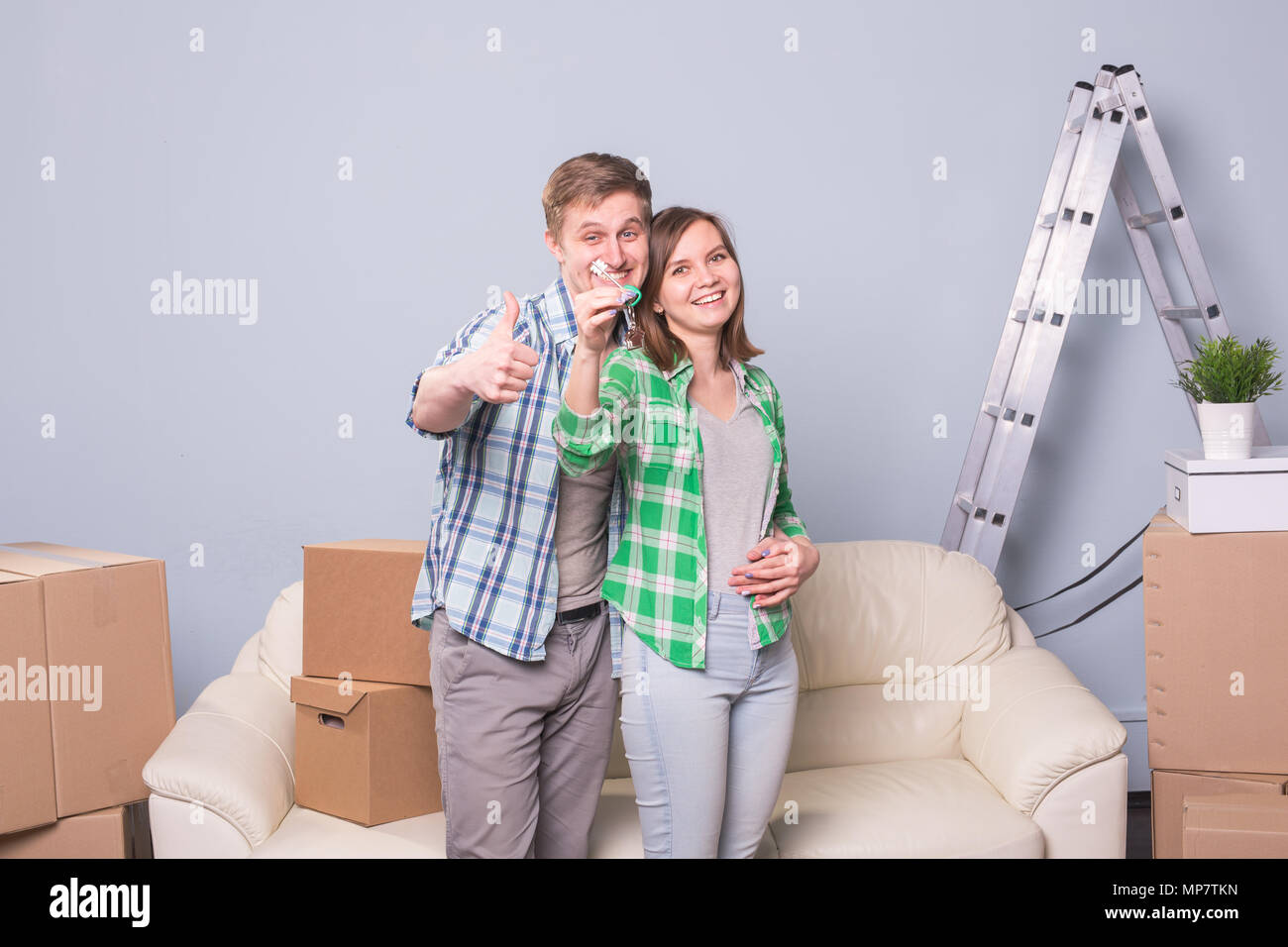 Happy love couple in her new home holding key Stock Photo - Alamy