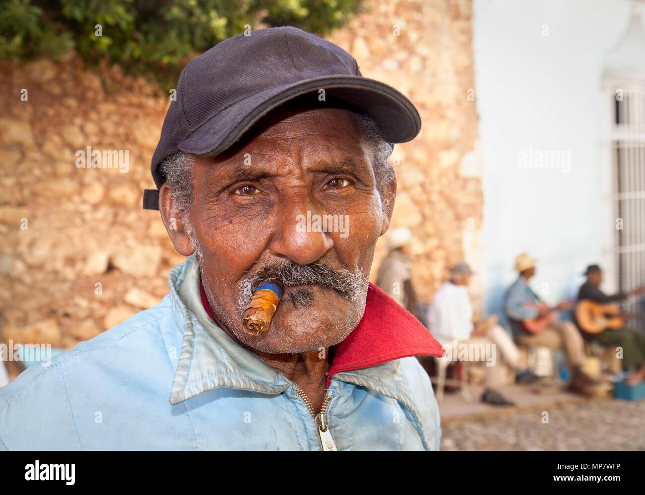 TRINIDAD,CUBA-JANUARY12:Unidentified Cubans smoking cigar on January 12. 2010.Trinidad,Cuba.Cubans of all ages are actively smoking cigars.All product Stock Photo