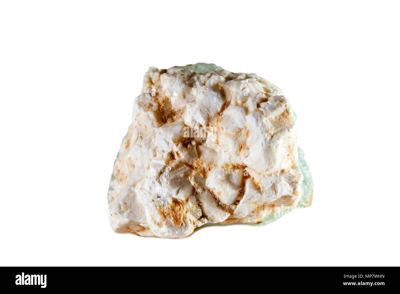 Macro shooting of natural gemstone. The raw mineral is prehnite. Isolated object on a white background. Stock Photo