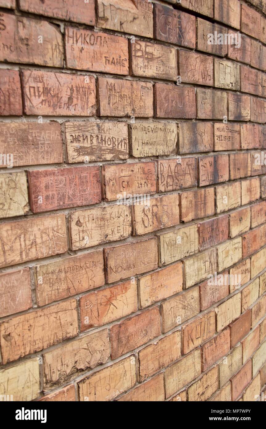 Inscriptions in brick Stock Photo - Alamy