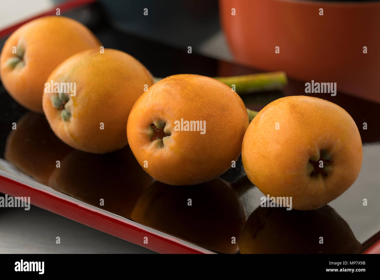 Fresh picked ripe loquats on a Japanese dish close up Stock Photo