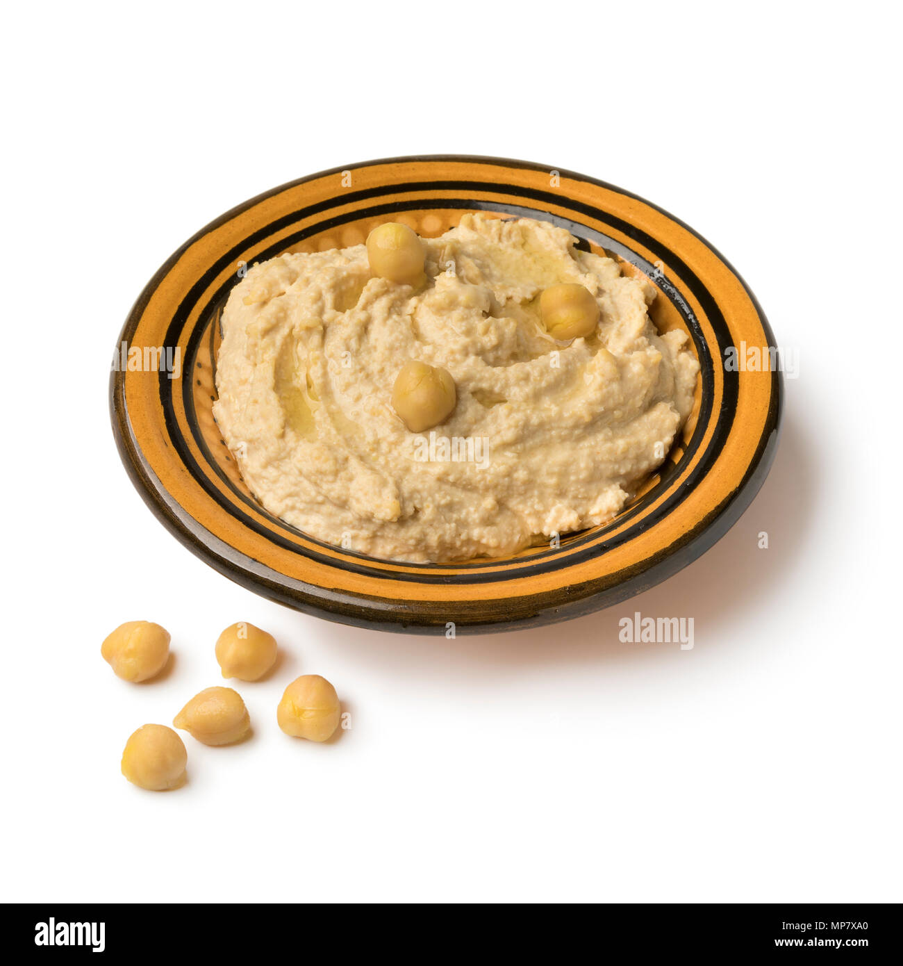 Traditional bowl with Lebanese hummus made from chickpeas isolated on white background Stock Photo