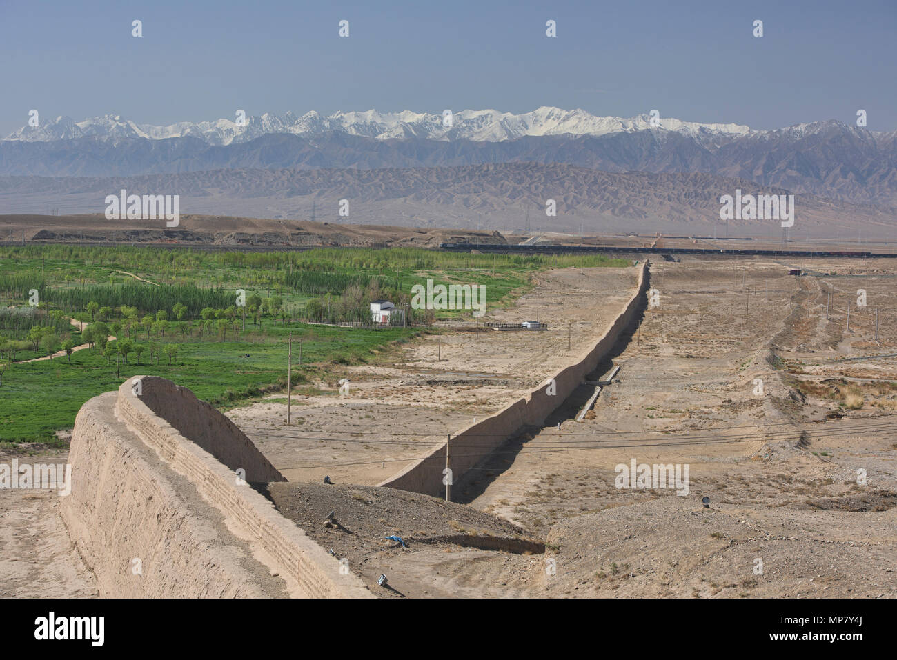 The original Great Wall at Jiayu Pass, with Qilian Mountains behind, Jiayuguan, Gansu, China Stock Photo