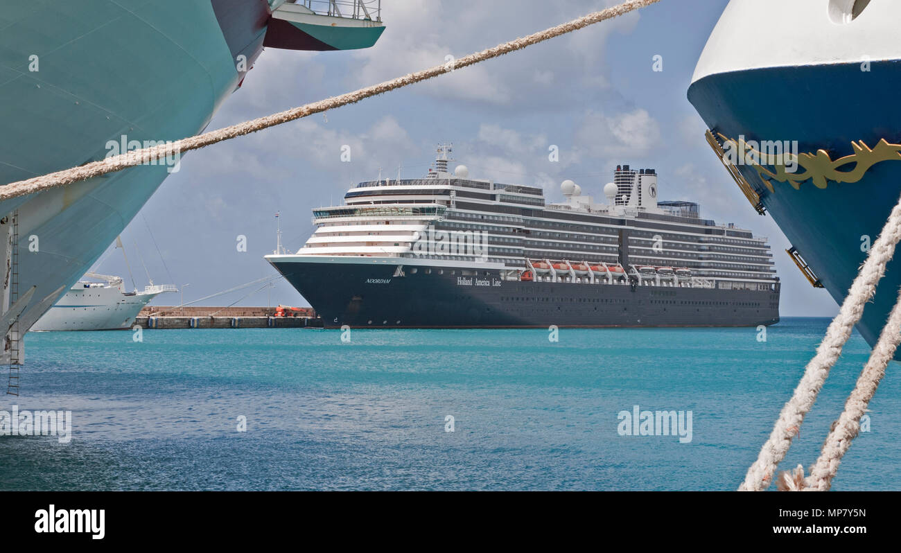 February 21, 2015- Bridgetown, Barbados: The Holland America Cruise Ship MS Noordam sits in port in the Barbados, framed by other cruise liners Stock Photo