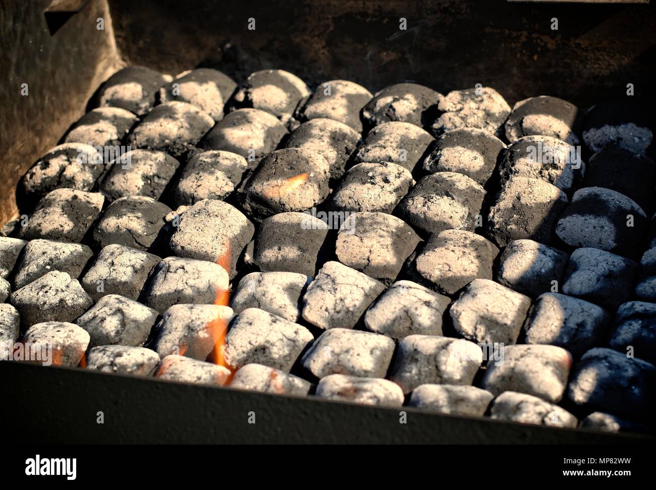 Outdoors and barbecue concept fire when lighting charcoal briquettes