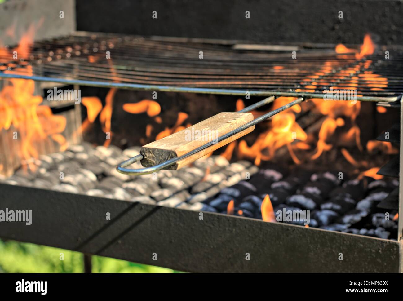 Outdoors and barbecue concept fire when lighting charcoal