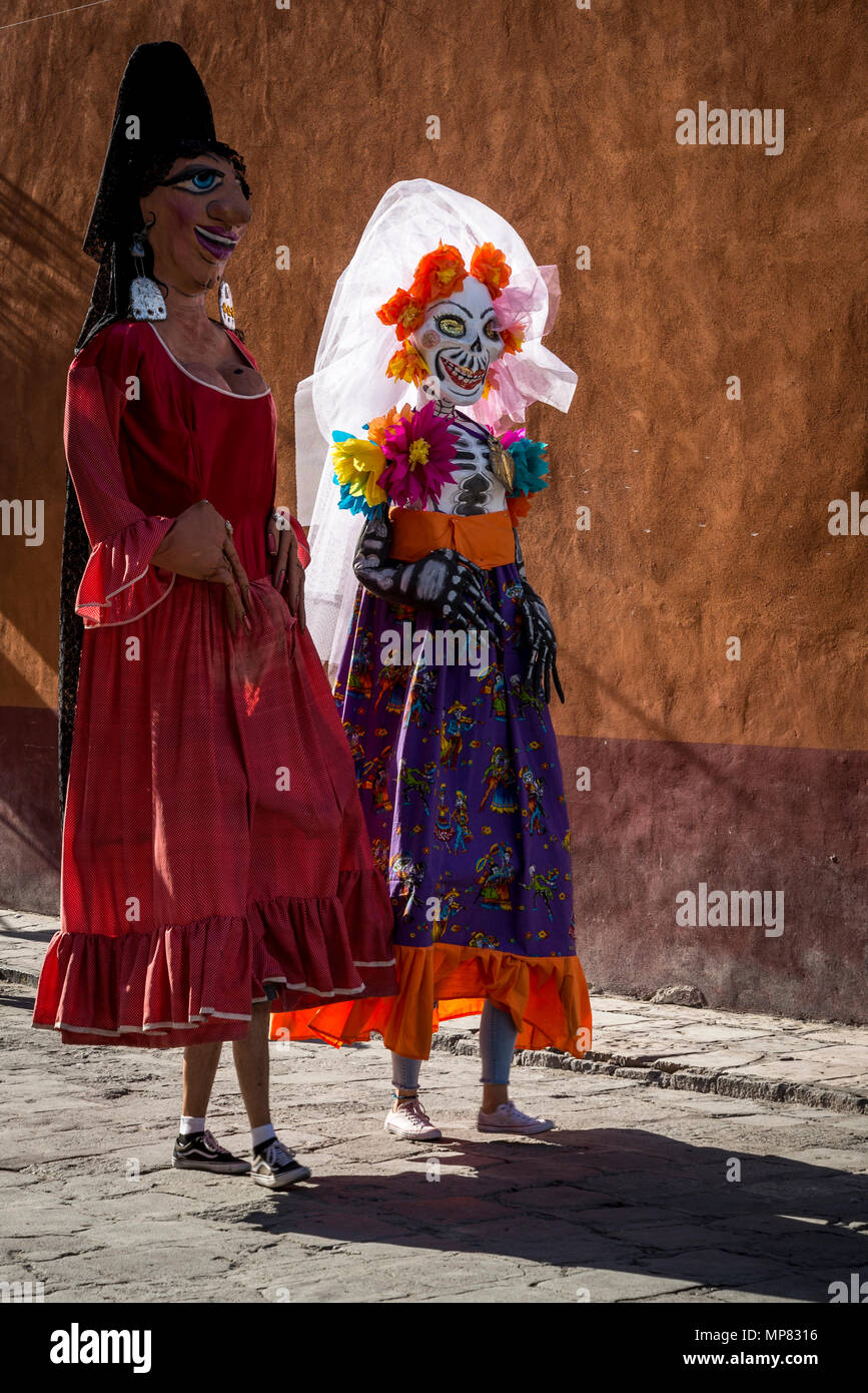 Traditional giant puppets called Mojiganga walking in a street, San Miguel de Allende, Mexico Stock Photo