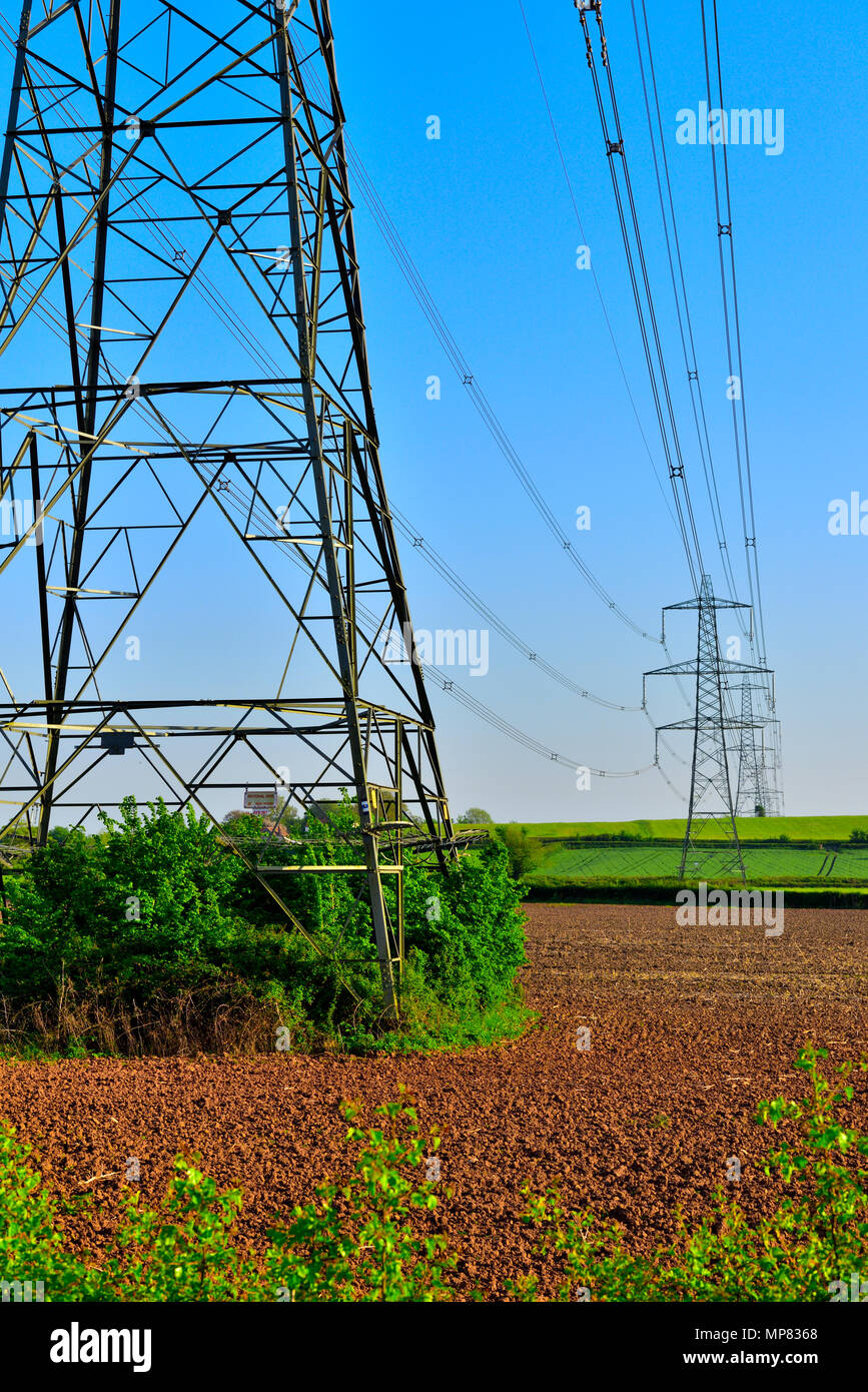 Electricity pylons crossing the South Gloucestershire countryside, England Stock Photo