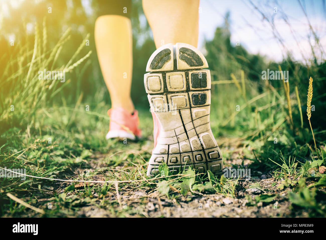 Walking or running exercise, legs on footpath in forest, achievement fitness  adventure and exercising in spring or summer nature Stock Photo - Alamy