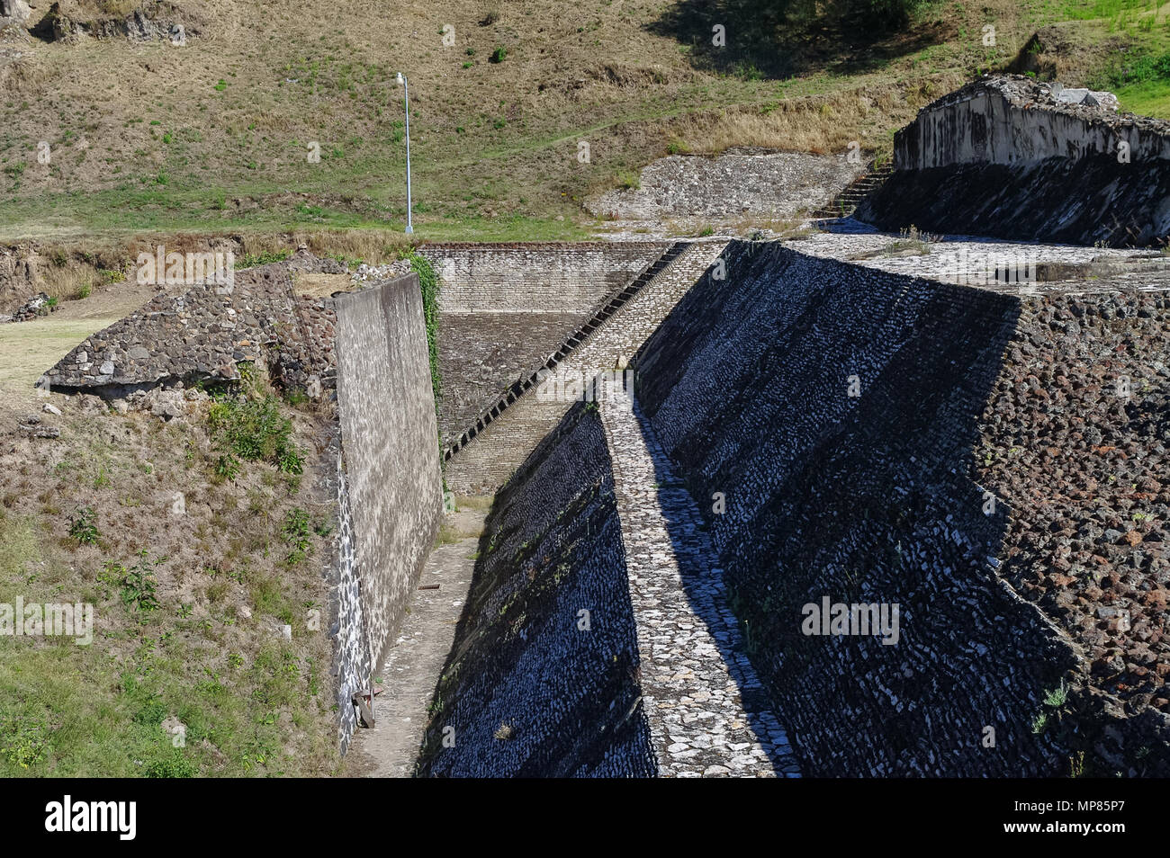 Ruins at the once sacred Aztec city of Cholula or Tlachihualtepetl (meaning artificial mountain). Mexico Stock Photo