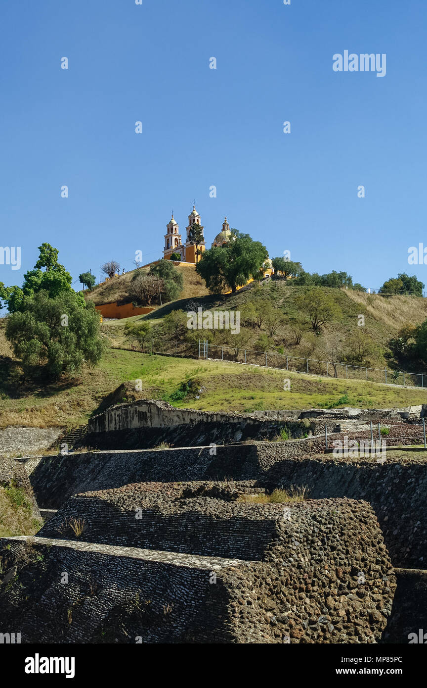 Ruins of Cholula pyramid with Church of Our Lady of Remedies at the top of it - Cholula, Puebla, Mexico Stock Photo