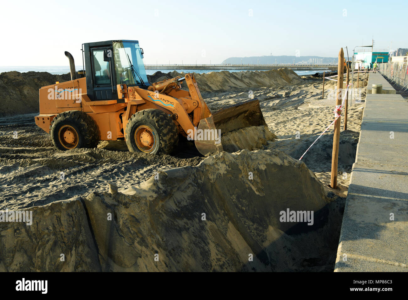 Durban, KwaZulu-Natal, South Africa, yellow excavation tractor moving
