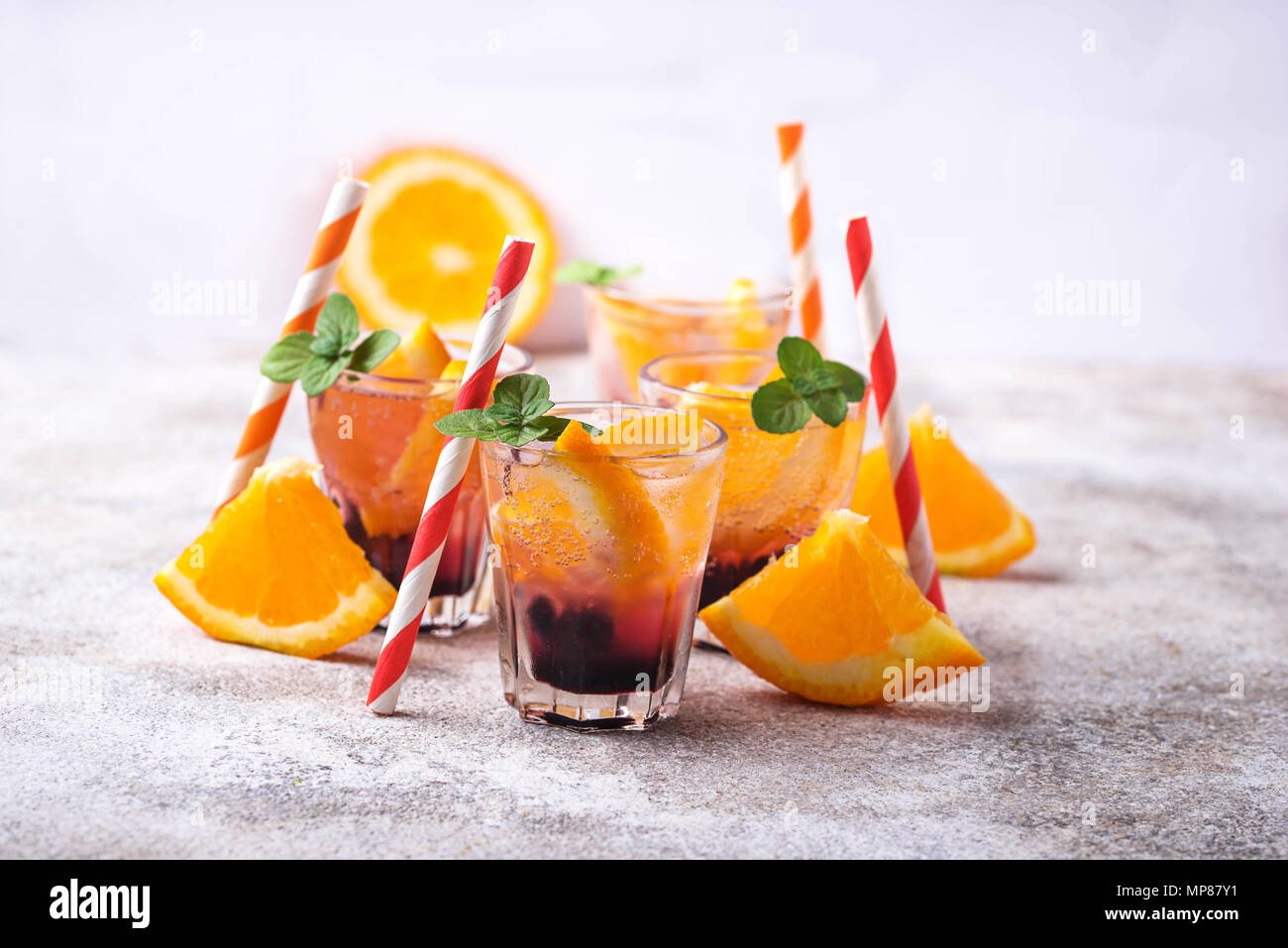 Summer  drink with orange and berries Stock Photo