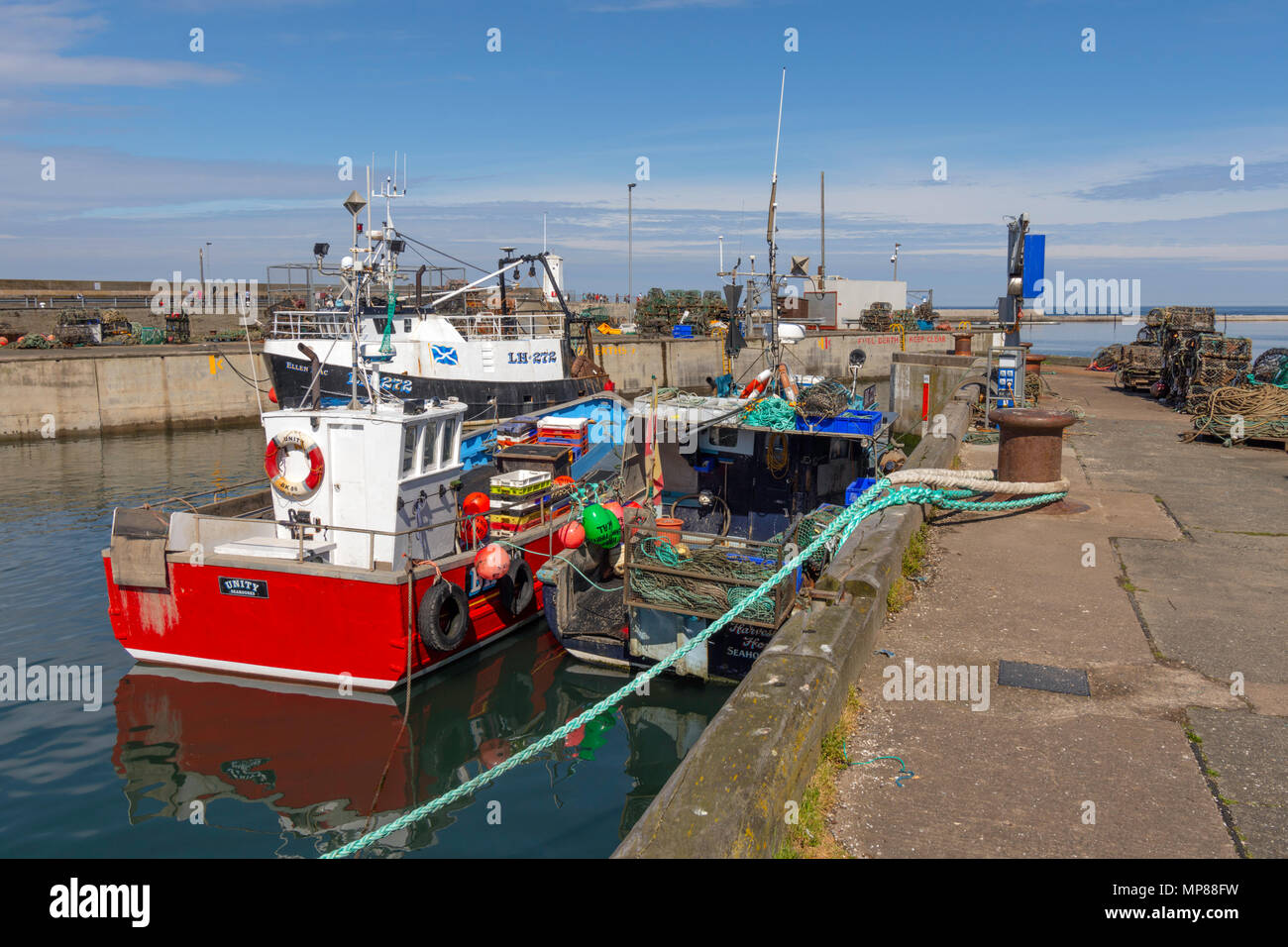 Boats in the harbour at seahouses hi-res stock photography and images ...