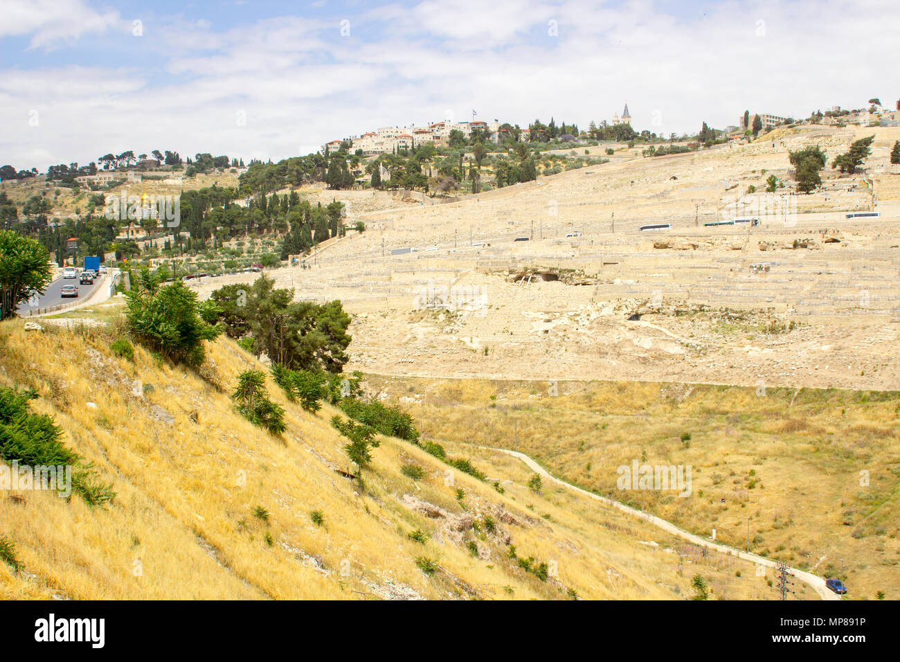 A view across the Kidron Valley to the Mount of Olives in Jerusalem from the steps to Hezekiah's Tunnel in the city of Jerusalem in Israel Stock Photo