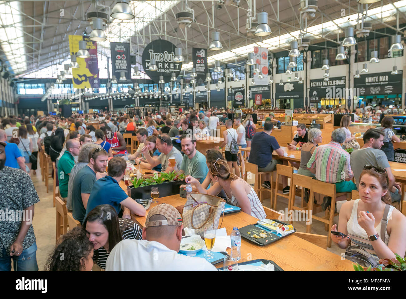 Lots of people come to have lunch at Time Out market in Lisbon. Stock Photo