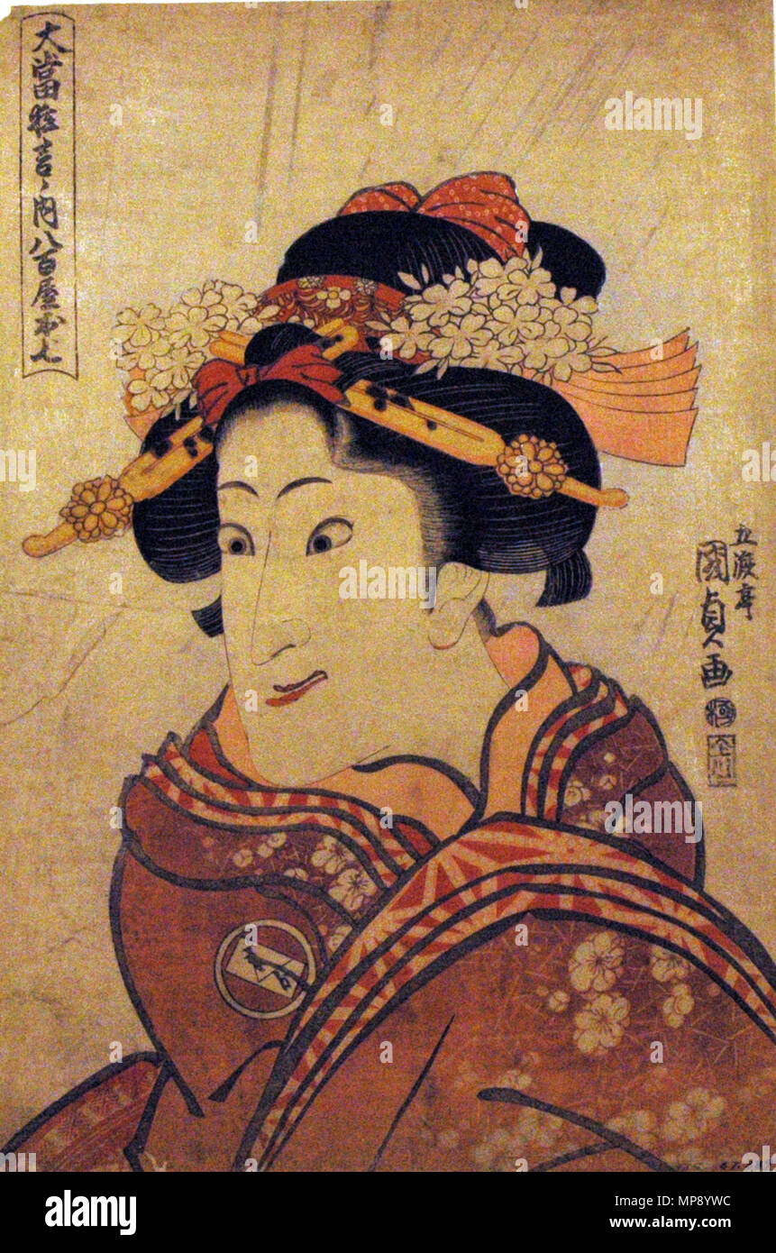 . English: Accession Number: 1957.389 Display Artist: Utagawa Kunisada Display Title: 'The actor Iwai Hanshiro V as the Greengrocer's daughter, Oshichi' Series Title: The Great Hits of the Stage (Oatari kyogen no uchi) Suite Name: Oatari kyogen no uchi Yaoya Oshichi Creation Date: ca. 1815 Medium: Woodblock Height: 14 3/4 in. Width: 9 7/8 in. Display Dimensions: 14 3/4 in. x 9 7/8 in. (37.47 cm x 25.08 cm) Publisher: Kawaguchiya Uhei Credit Line: Bequest of Mrs. Cora Timken Burnett Label Copy: 'One of the most memorable characters in Kabuki, Oshichi is the heroine in a drama of forbidden love. Stock Photo