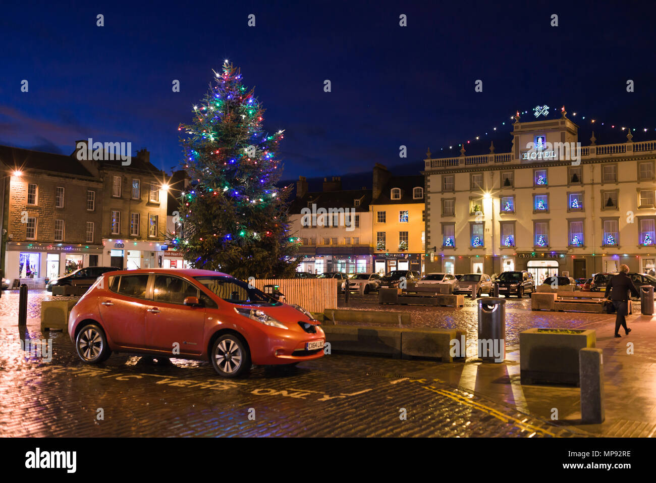An electric car recharges in Kelso, Scotland, town centre market square