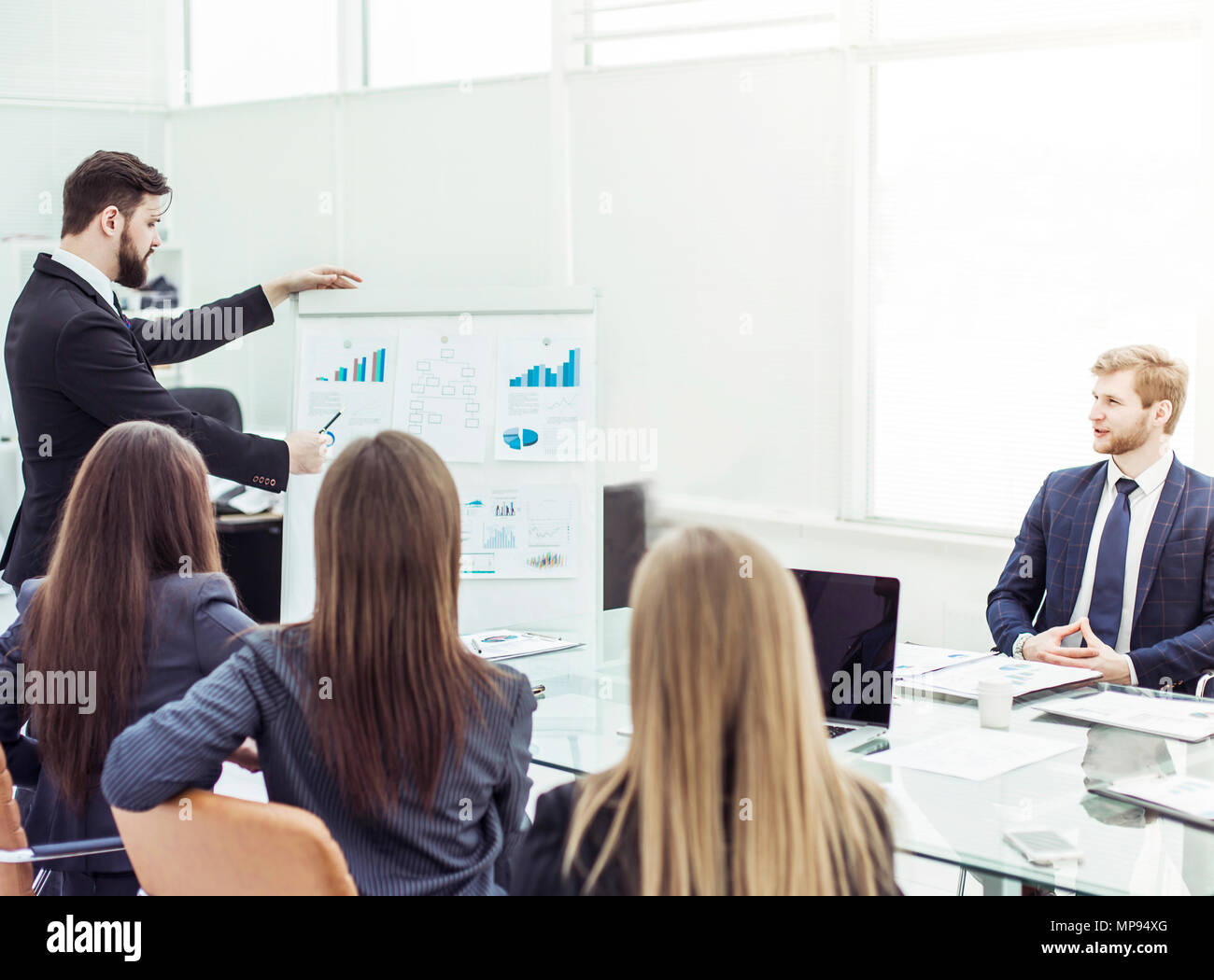 presentation of a new financial project on a workplace at office Stock