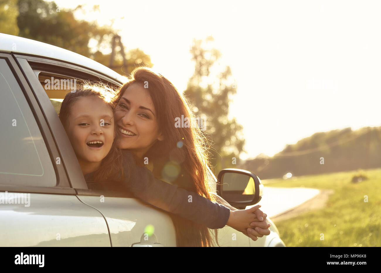 Happy Traveling Laughing Mother And Kid Girl Looking From The New Car Window On The Beautiful Nature Background Good Purchase Of Vehicle Stock Photo Alamy