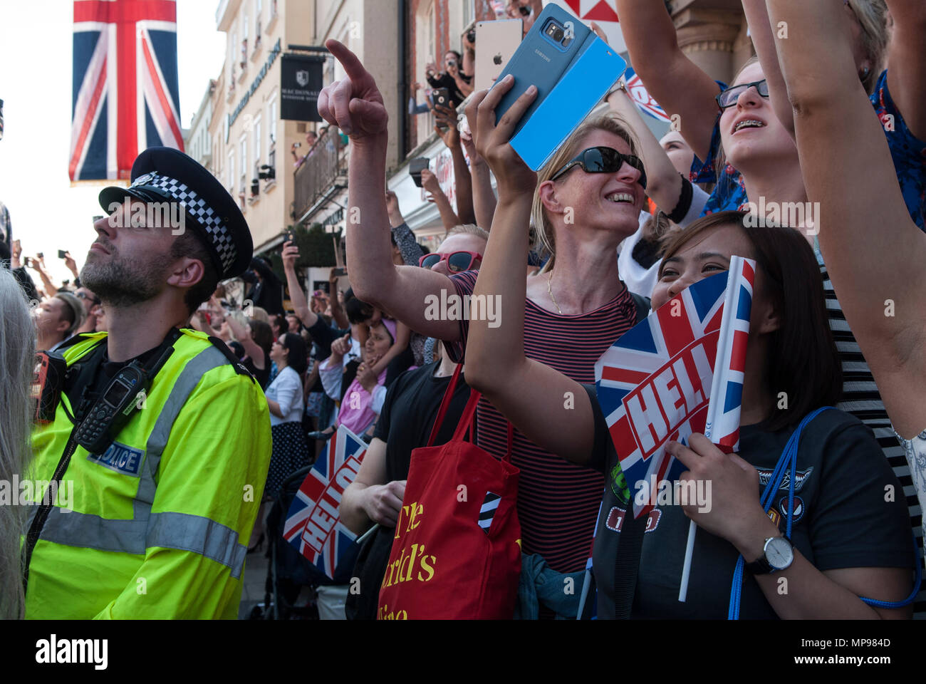 Duke and Duchess of Sussex royal wedding. People in crowd with mobile devises phones iphones i phone tourists watching  to take photo of Prince Harry Meghan Markle  procession  Windsor Uk 2018 HOMER SYKES Stock Photo