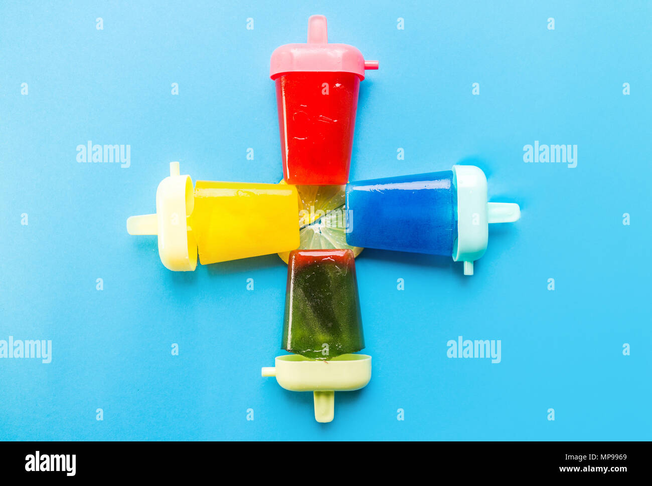Homemade popsicles isolated on blue background Stock Photo