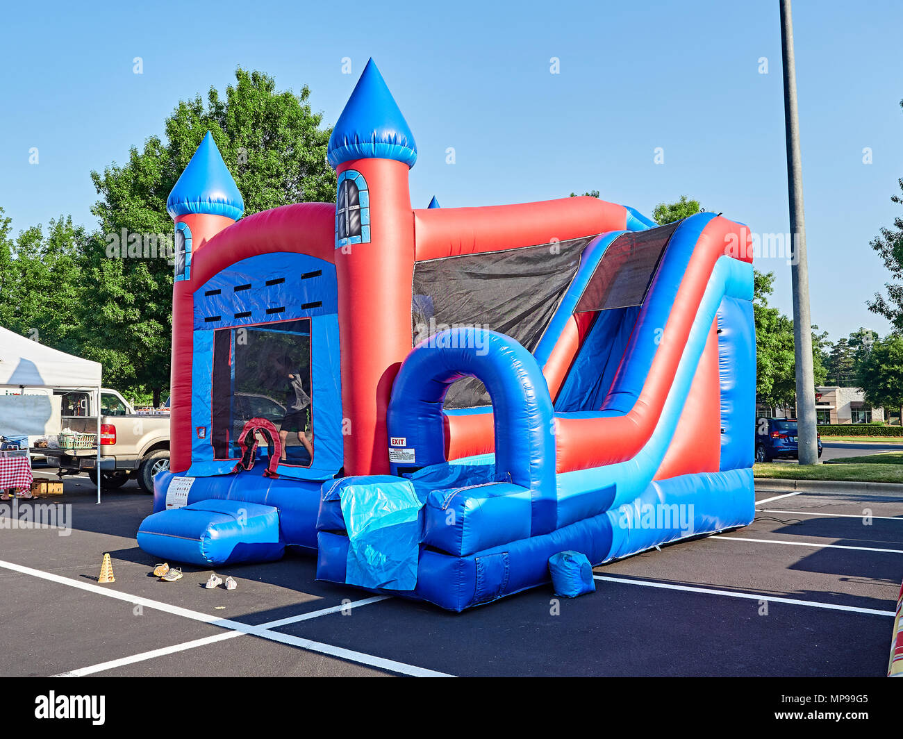 Inflatable bounce or bouncy house in shape of a castle designed for children at a local outdoor market in Montgomery Alabama, USA. Stock Photo