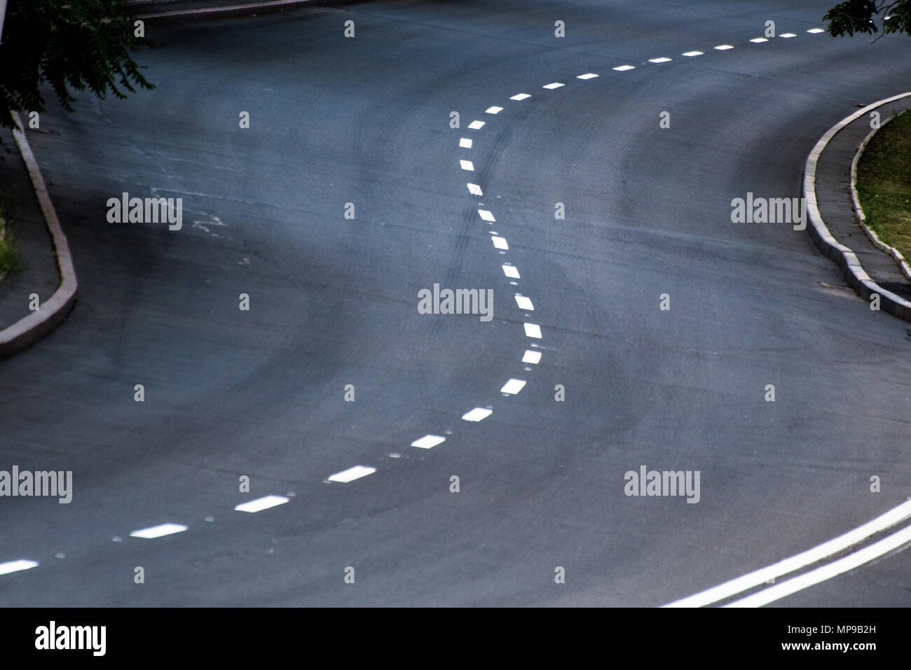 A winding road with markings Stock Photo - Alamy