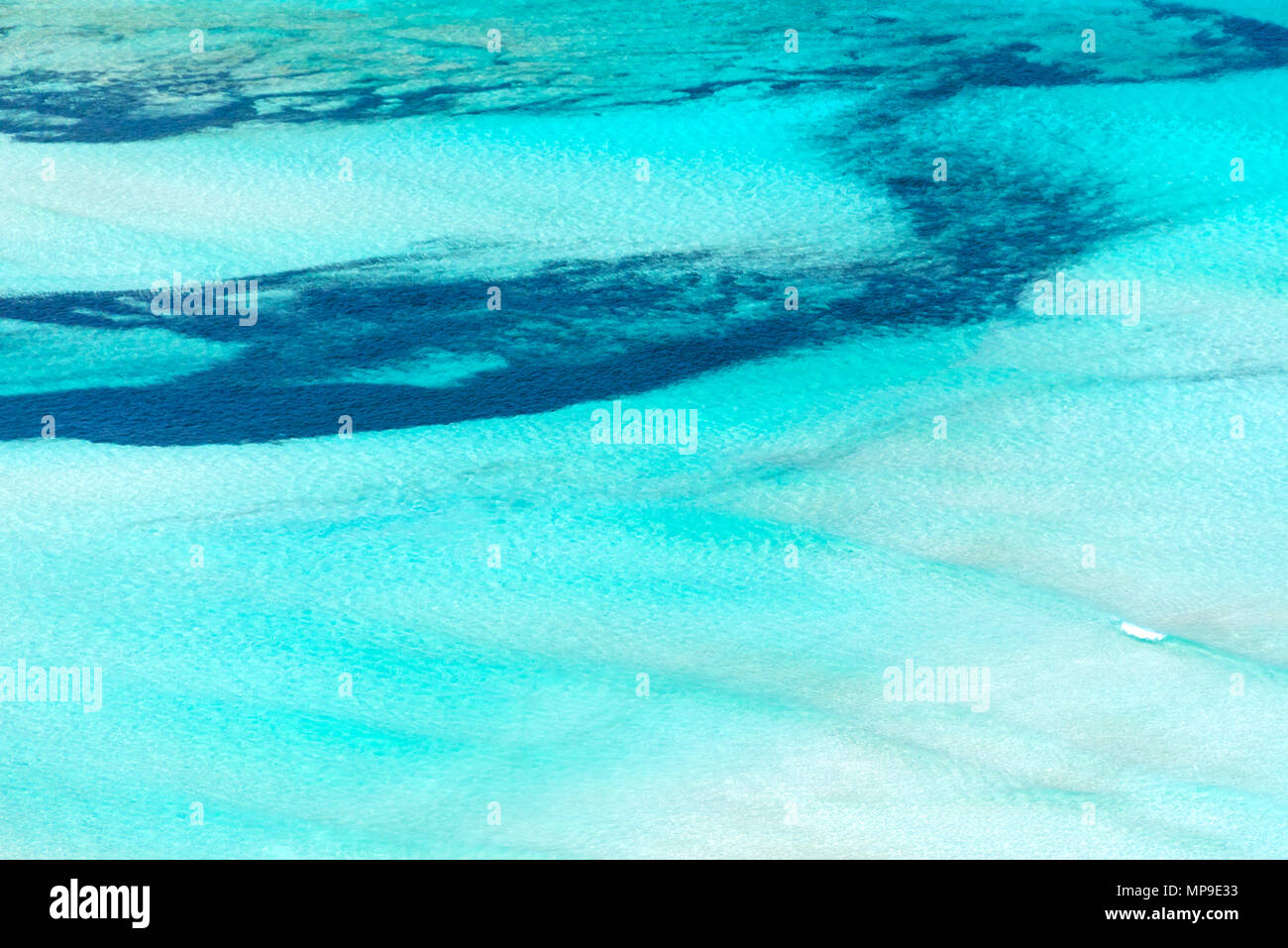 Abstract aerial view of an exotic lagoon with turquoise pristine water Stock Photo