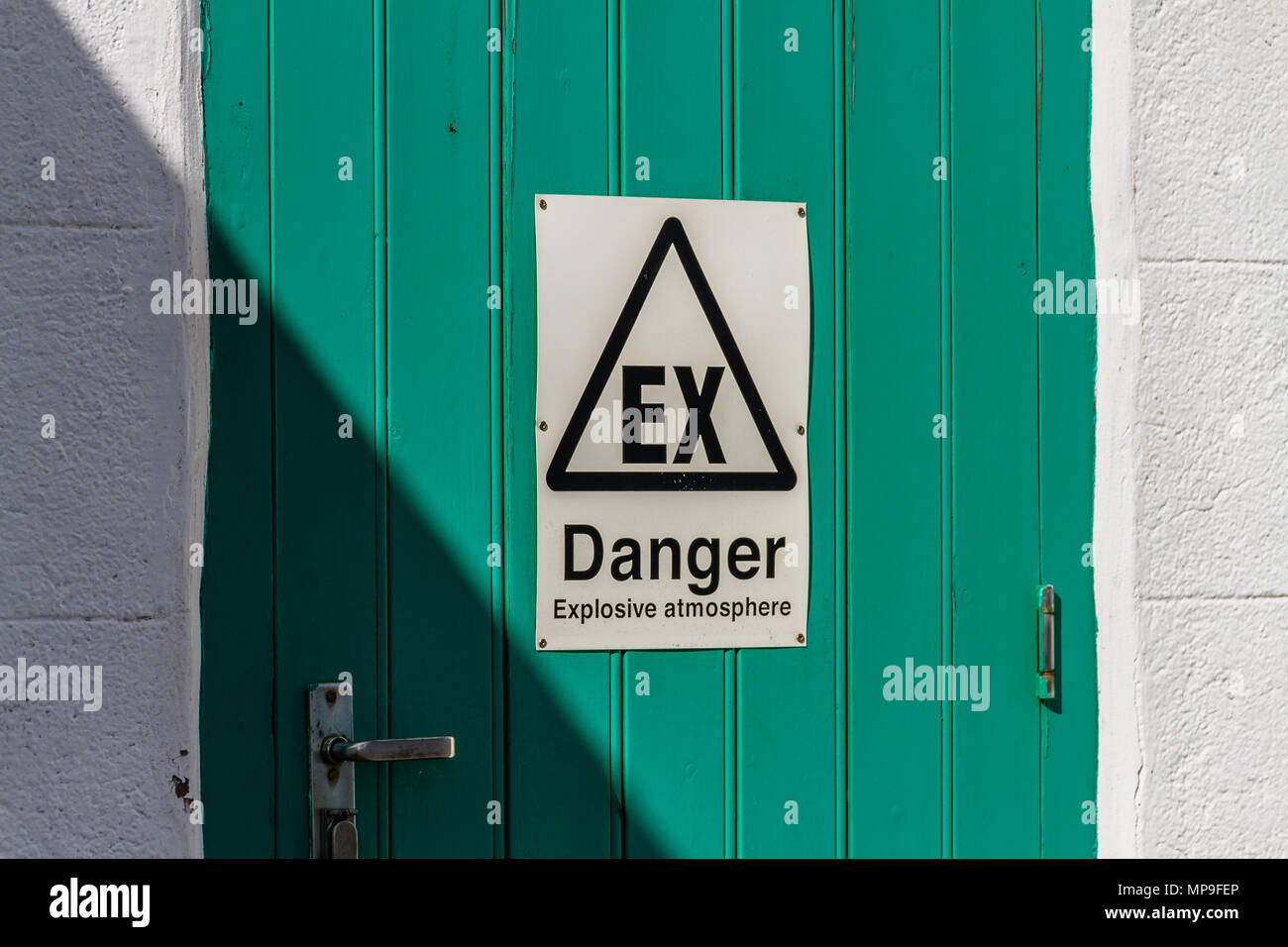 Sign on lighthouse door warning of an Explosive Atmosphere due to fumes. Brixham, Devon, UK. March 2018. Stock Photo