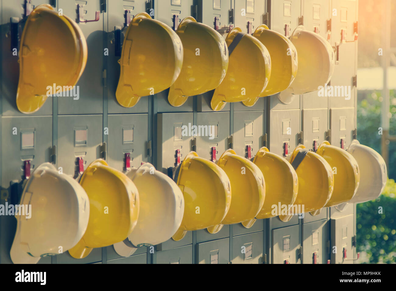 Safety helmet hanging on locker for worker equipment Stock Photo Alamy