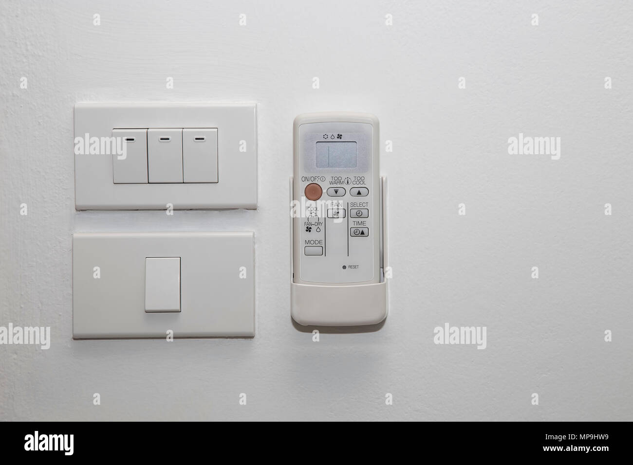 Light switch and remote control for air conditioner Stock Photo