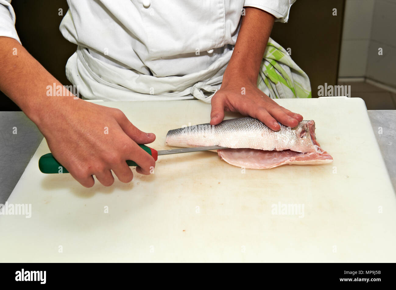 the cleaning of the sea bass Stock Photo Alamy